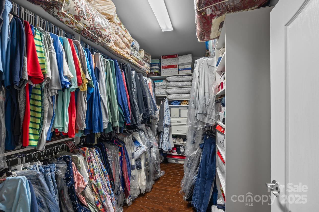 276 Grovefield Drive Fort Mill, SC 29715 - Photo 32 of 44 a view of walk in closet with clothes