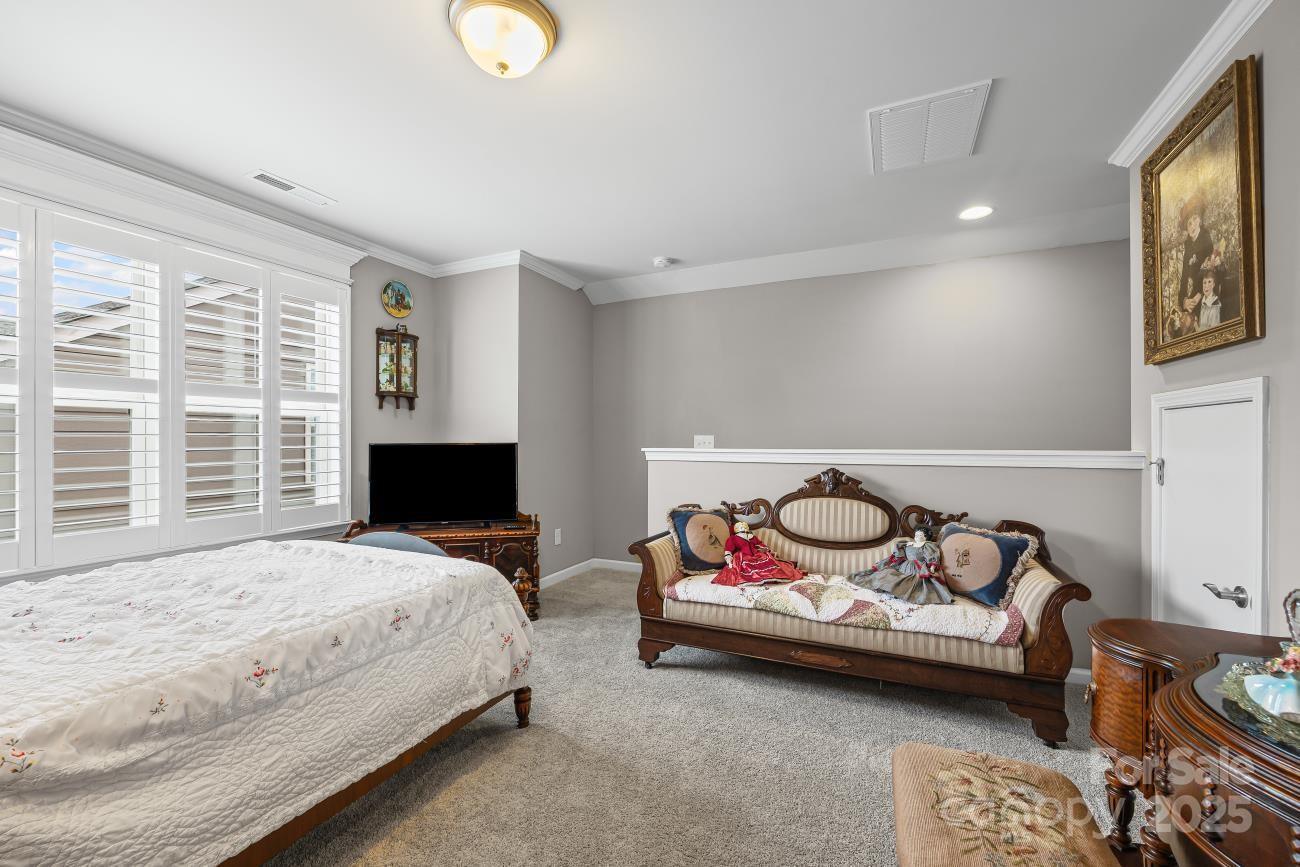 276 Grovefield Drive Fort Mill, SC 29715 - Photo 34 of 44 a bedroom with bed and a couch