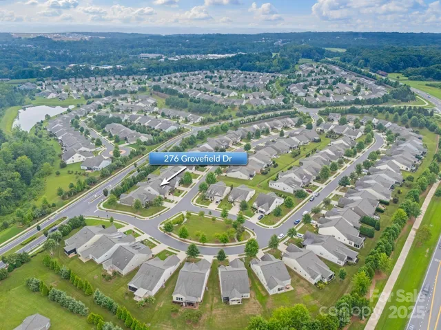 a view of a swimming pool with a yard