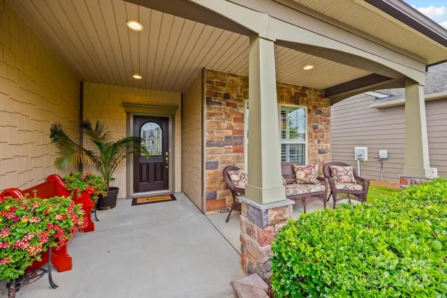 a front view of a house with an outdoor seating
