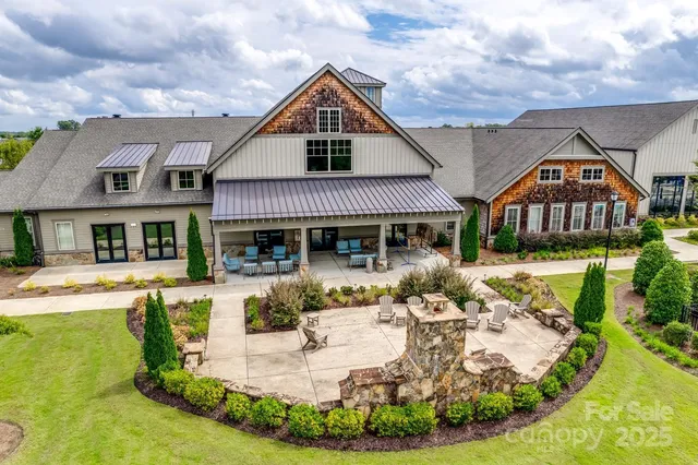 an aerial view of a house with a swimming pool