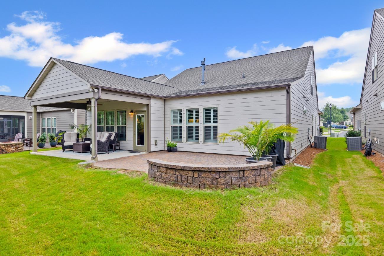 276 Grovefield Drive Fort Mill, SC 29715 - Photo 5 of 44 a view of a house with a yard patio and swimming pool