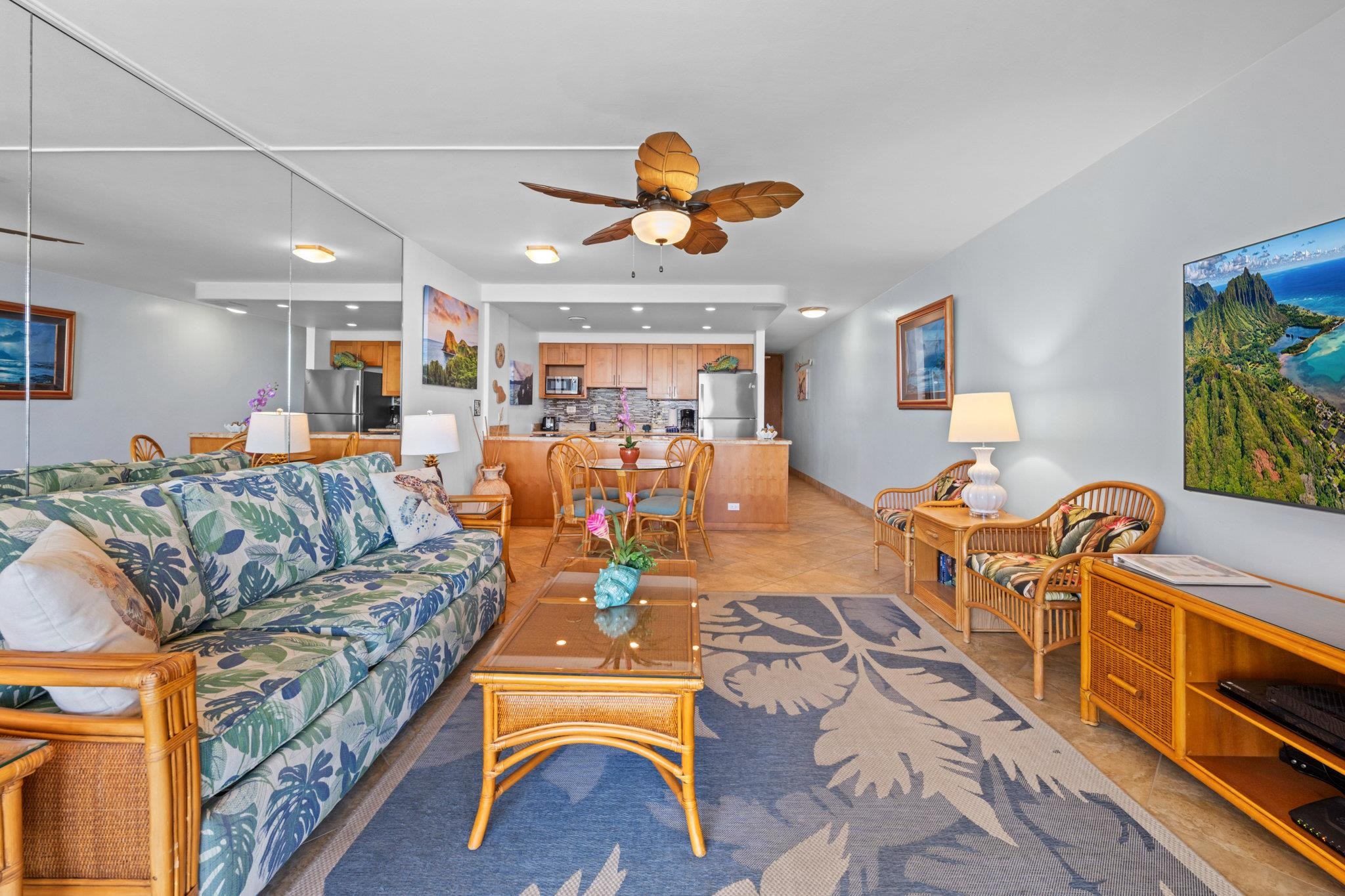 4471 Lower Honoapiilani Road, Unit 415 Lahaina, HI 96761 - Photo 12 of 44 a living room with furniture kitchen view and a chandelier