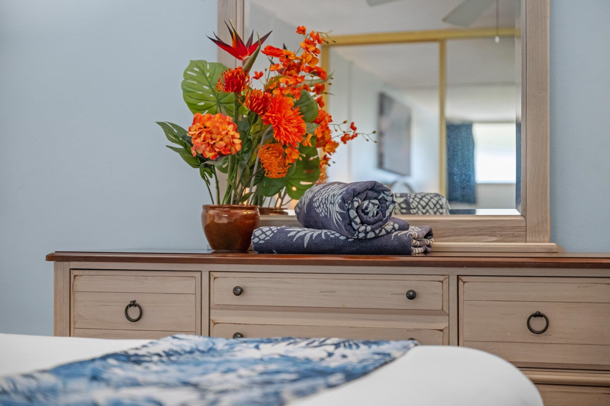 4471 Lower Honoapiilani Road, Unit 415 Lahaina, HI 96761 - Photo 26 of 44 a potted plant sitting on top of a shelf