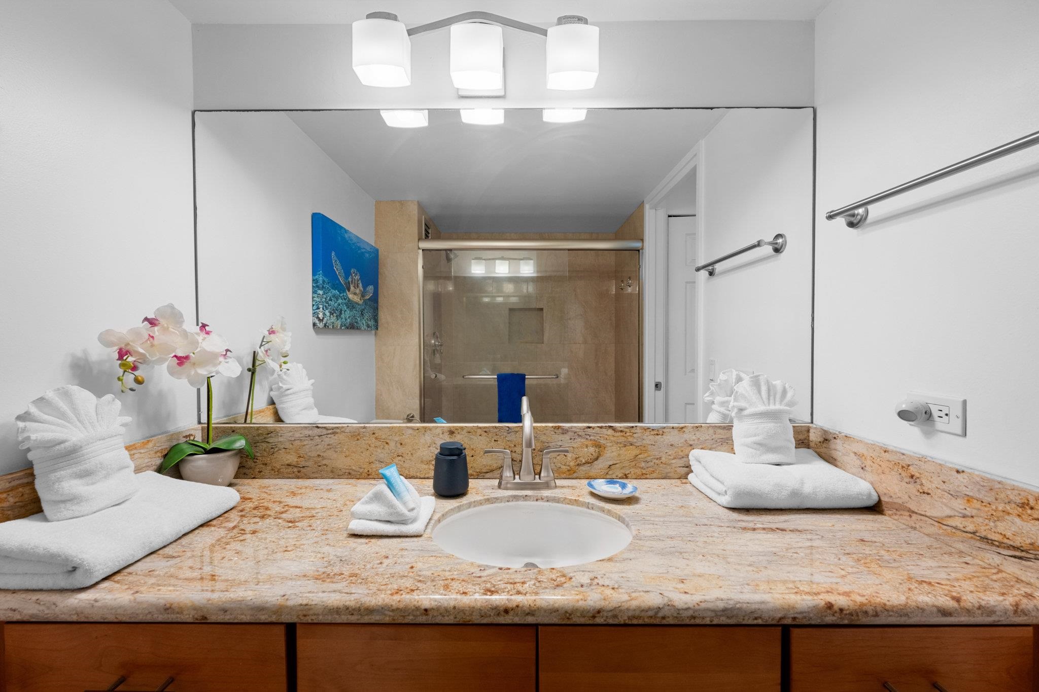 4471 Lower Honoapiilani Road, Unit 415 Lahaina, HI 96761 - Photo 31 of 44 a bathroom with a granite countertop double vanity and a mirror