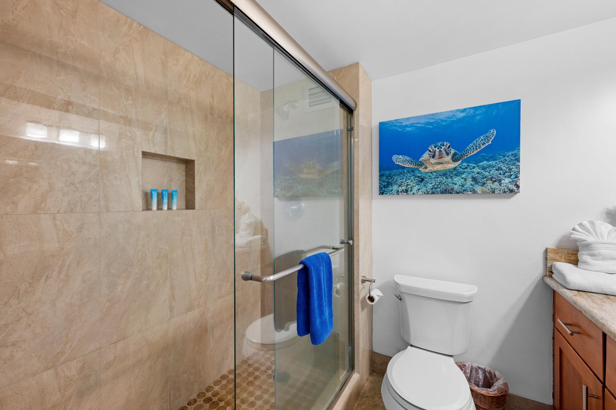 4471 Lower Honoapiilani Road, Unit 415 Lahaina, HI 96761 - Photo 33 of 44 a white toilet sitting next to a bathroom sink