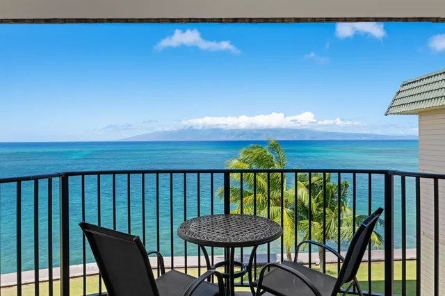 swimming pool view with a seating space