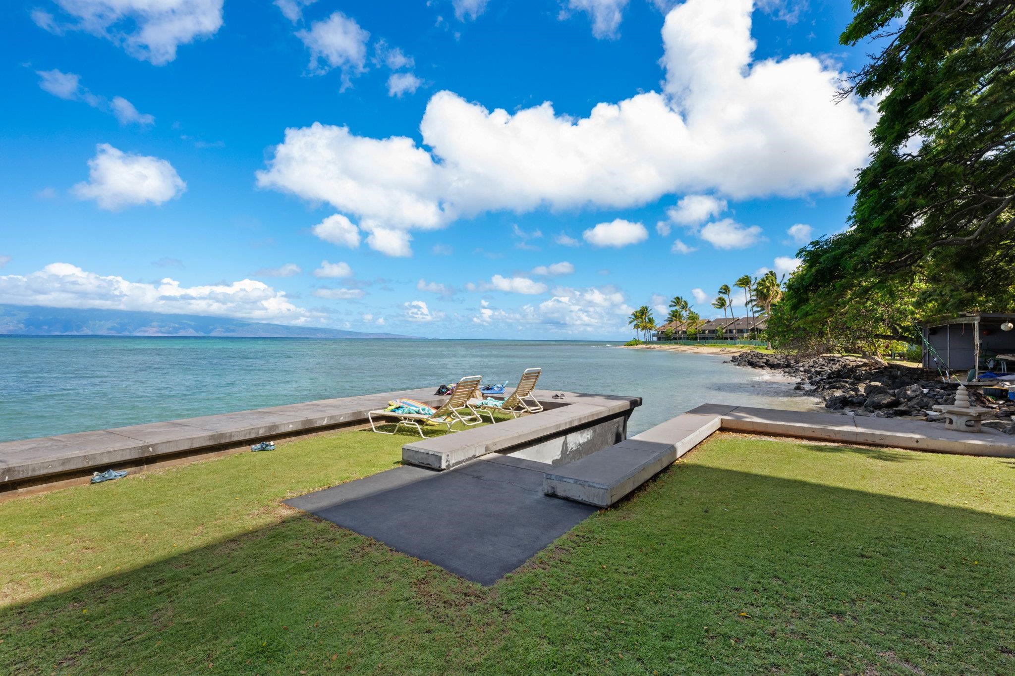 4471 Lower Honoapiilani Road, Unit 415 Lahaina, HI 96761 - Photo 38 of 44 a view of a lake with couches chairs