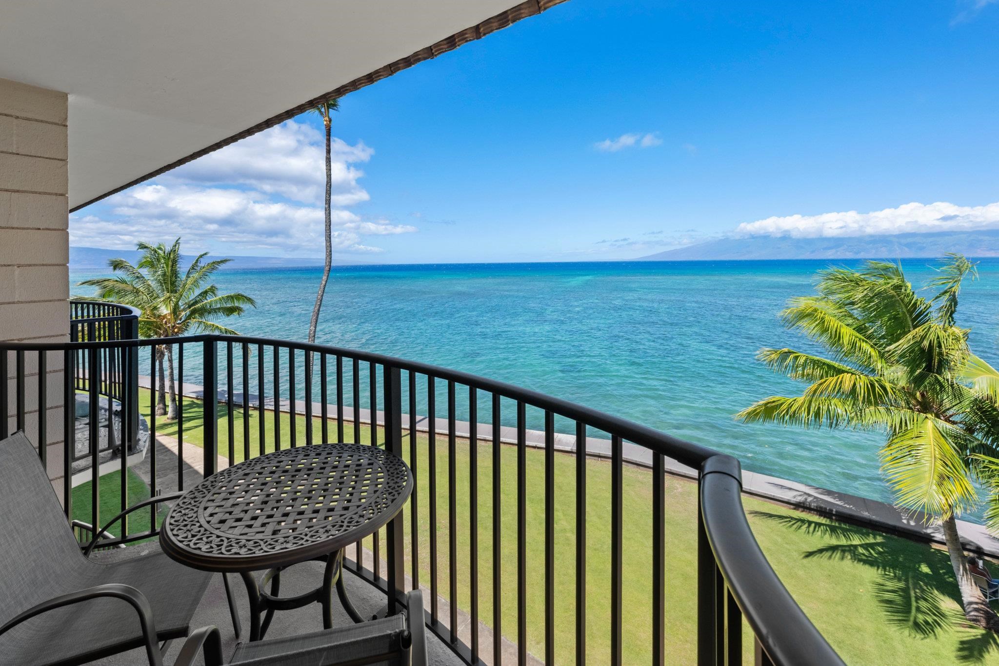 4471 Lower Honoapiilani Road, Unit 415 Lahaina, HI 96761 - Photo 39 of 44 a view of a balcony with chair and table