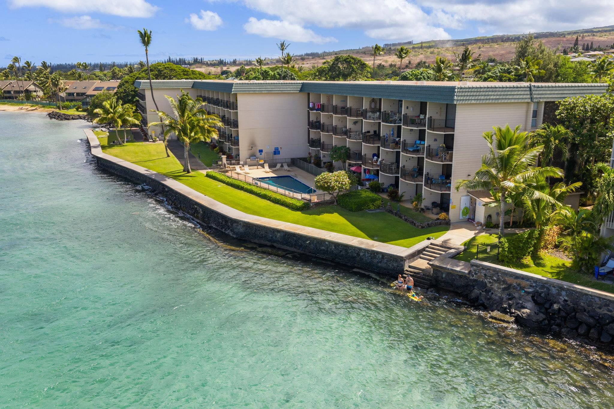 4471 Lower Honoapiilani Road, Unit 415 Lahaina, HI 96761 - Photo 42 of 44 an outdoor sitting area with a lake view