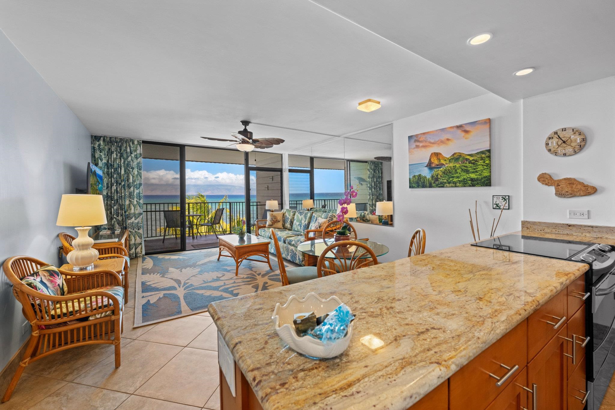 4471 Lower Honoapiilani Road, Unit 415 Lahaina, HI 96761 - Photo 9 of 44 a living room with furniture and a flat screen tv