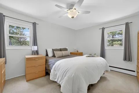 a bedroom with bed and a window