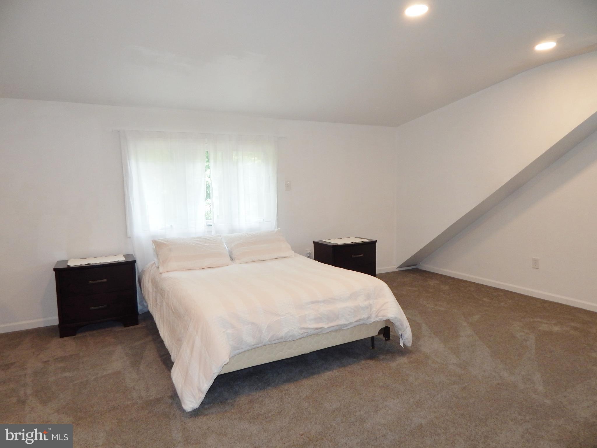 9716 Wynmill Road Philadelphia, PA 19115 - Photo 14 of 23 a bedroom with a bed and window