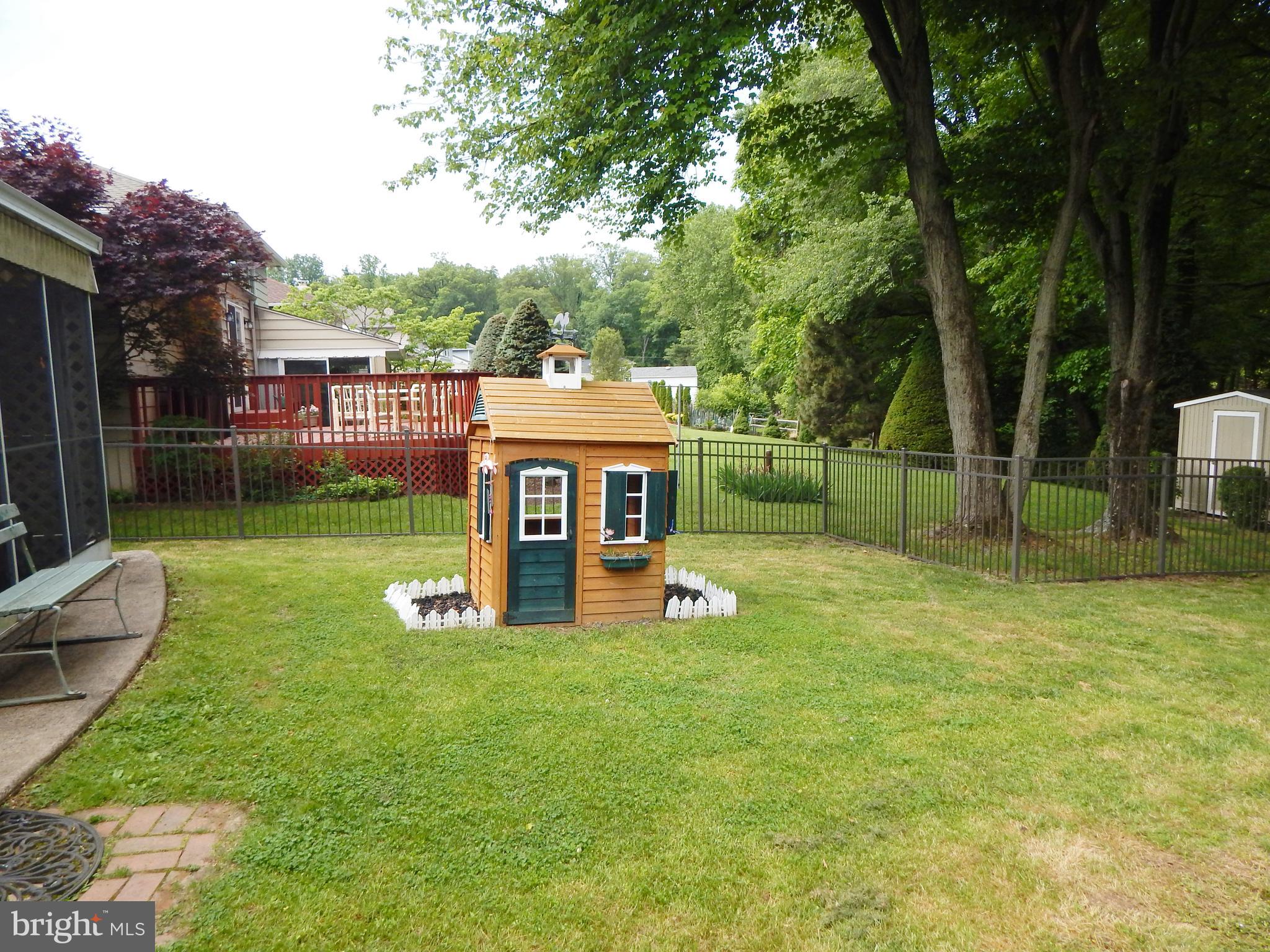 9716 Wynmill Road Philadelphia, PA 19115 - Photo 22 of 23 a view of a garden with a slide