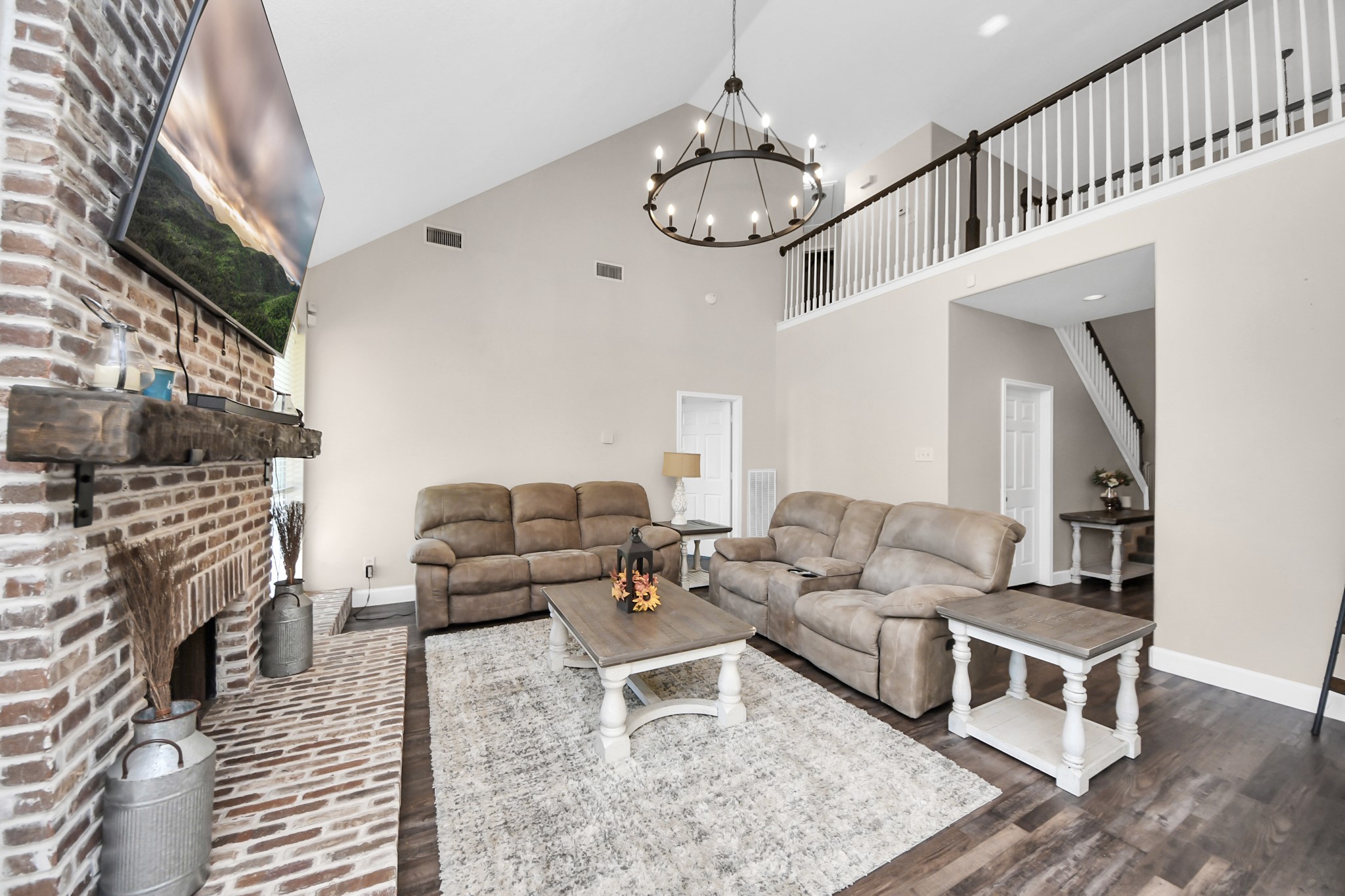 10514 Ravens Way Baytown, TX 77523 - Photo 12 of 50 Alternate view capturing the living room’s connection from the kitchen and main-level areas.