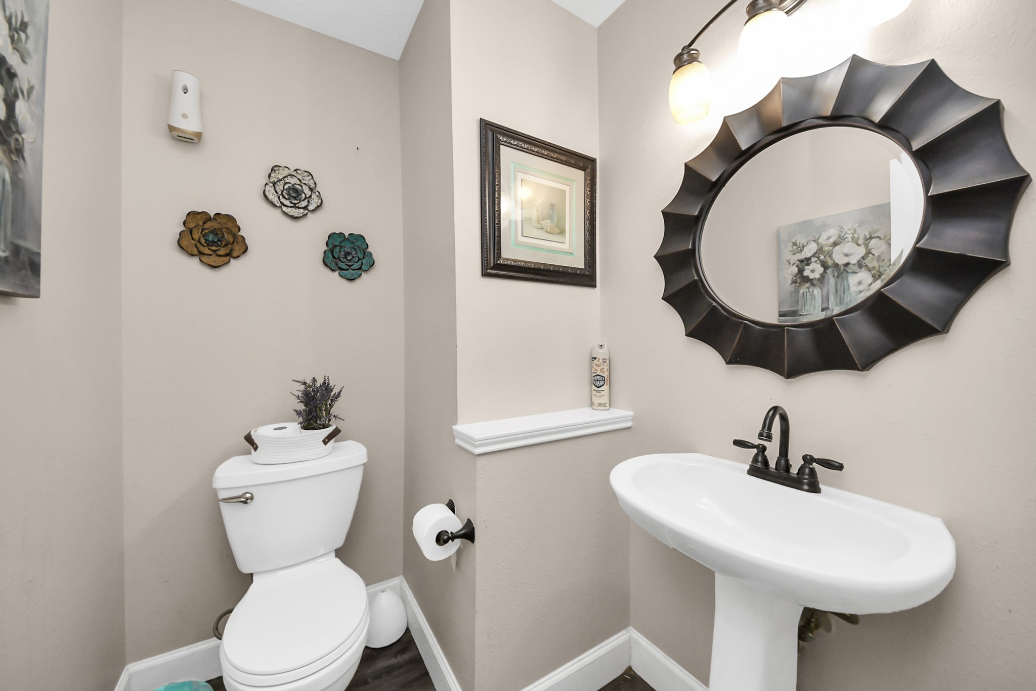 10514 Ravens Way Baytown, TX 77523 - Photo 14 of 50 Main-level half bathroom offering functionality and comfort for the household.