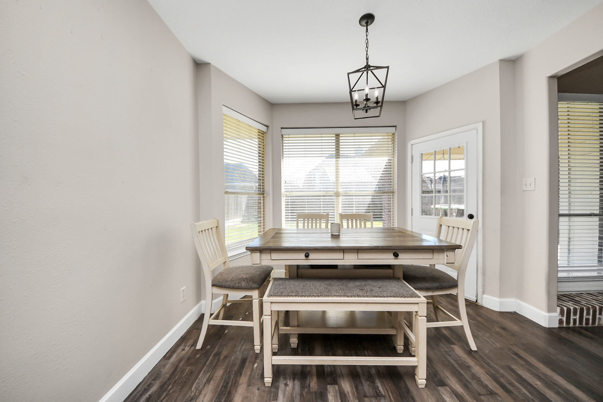 10514 Ravens Way Baytown, TX 77523 - Photo 31 of 50 Cozy breakfast nook ideal for casual meals and morning coffee with a view of the backyard.