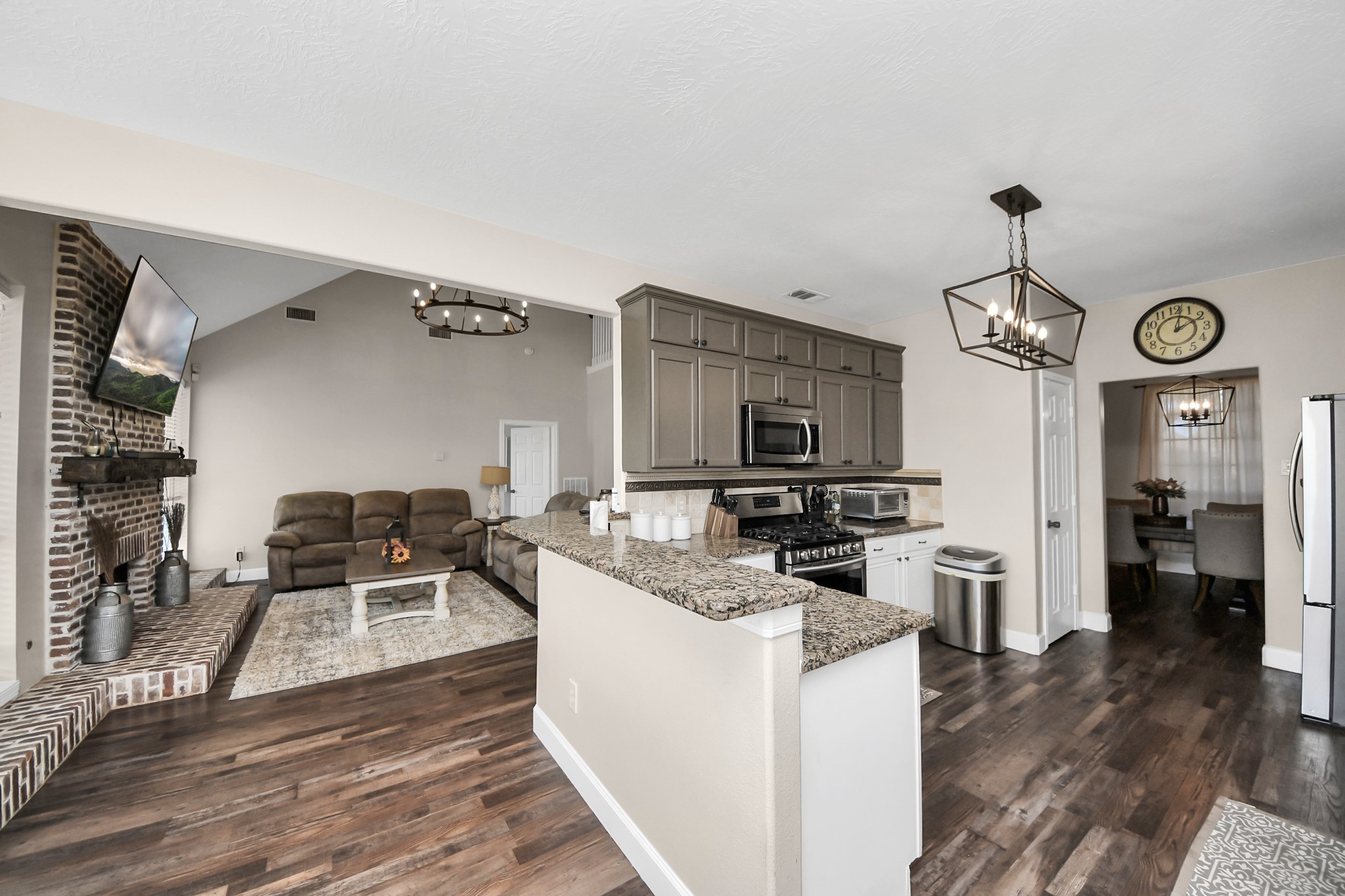 10514 Ravens Way Baytown, TX 77523 - Photo 33 of 50 Looking into the kitchen and living area, showcasing an open-concept design perfect for entertaining.