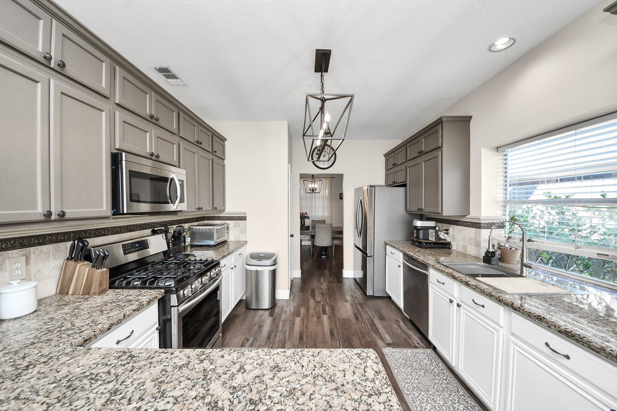 10514 Ravens Way Baytown, TX 77523 - Photo 34 of 50 Functional kitchen with plenty of cabinet space and room for meal preparation. Adjacent breakfast nook offers casual dining options.
