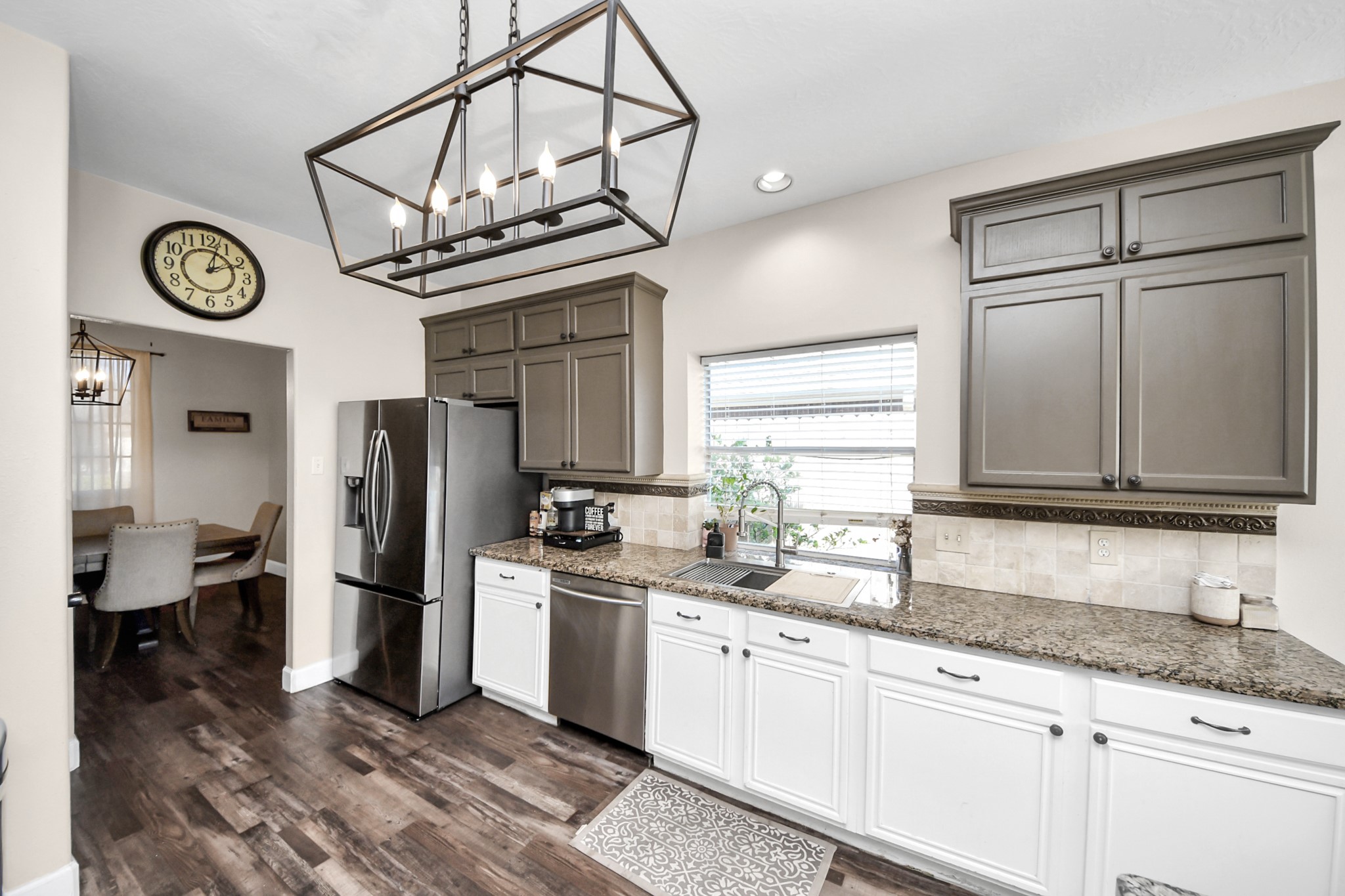 10514 Ravens Way Baytown, TX 77523 - Photo 36 of 50 View of the kitchen from the entrance, highlighting the layout and countertop space.