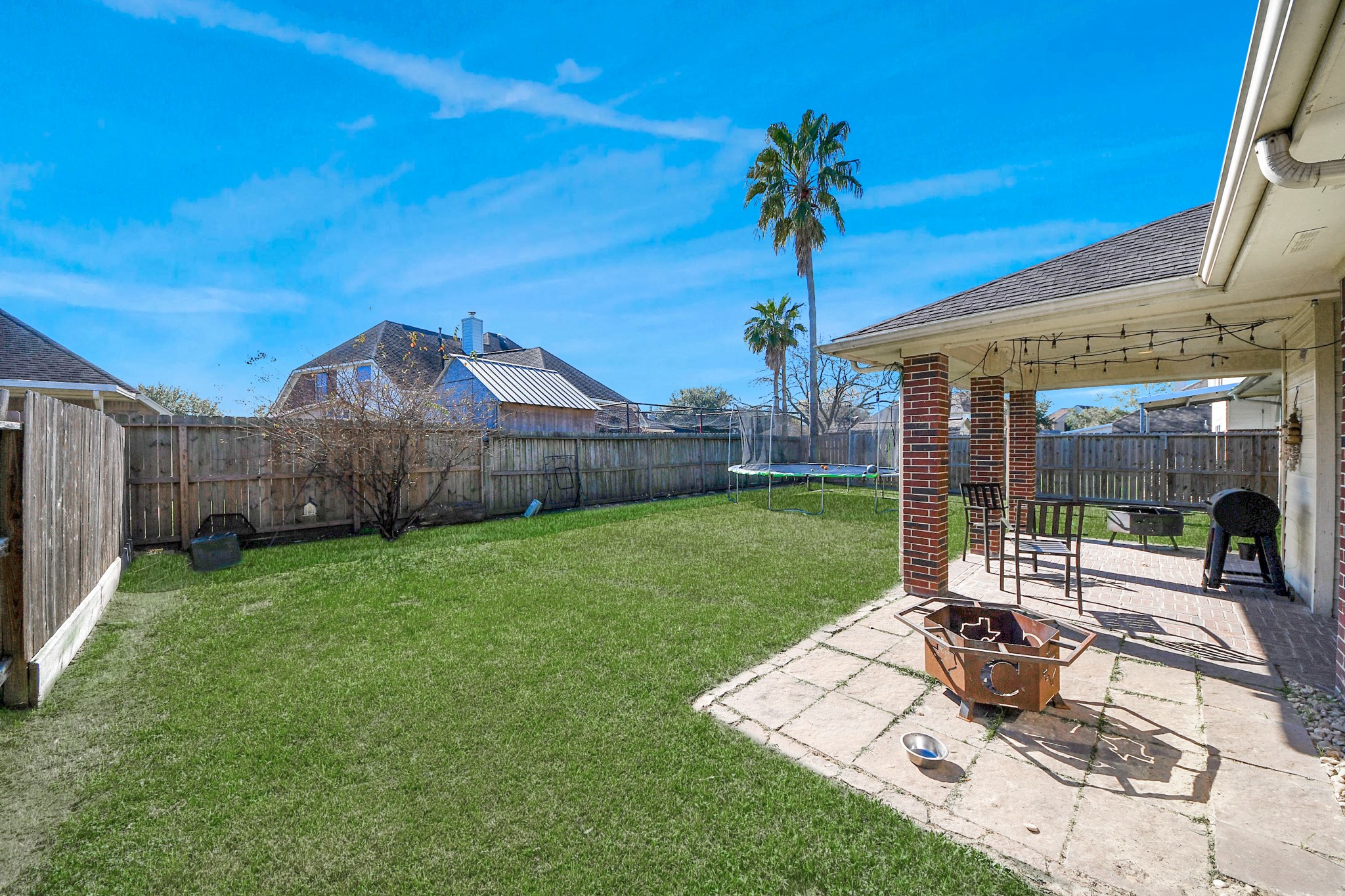 10514 Ravens Way Baytown, TX 77523 - Photo 5 of 50 Spacious backyard perfect for entertaining, relaxing, or adding your personal touch. Ideal for family activities and outdoor living.