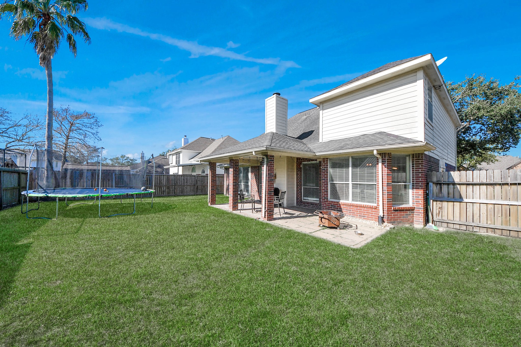 10514 Ravens Way Baytown, TX 77523 - Photo 6 of 50 Wide view of the backyard, showcasing the expansive outdoor space ideal for entertaining or relaxing.