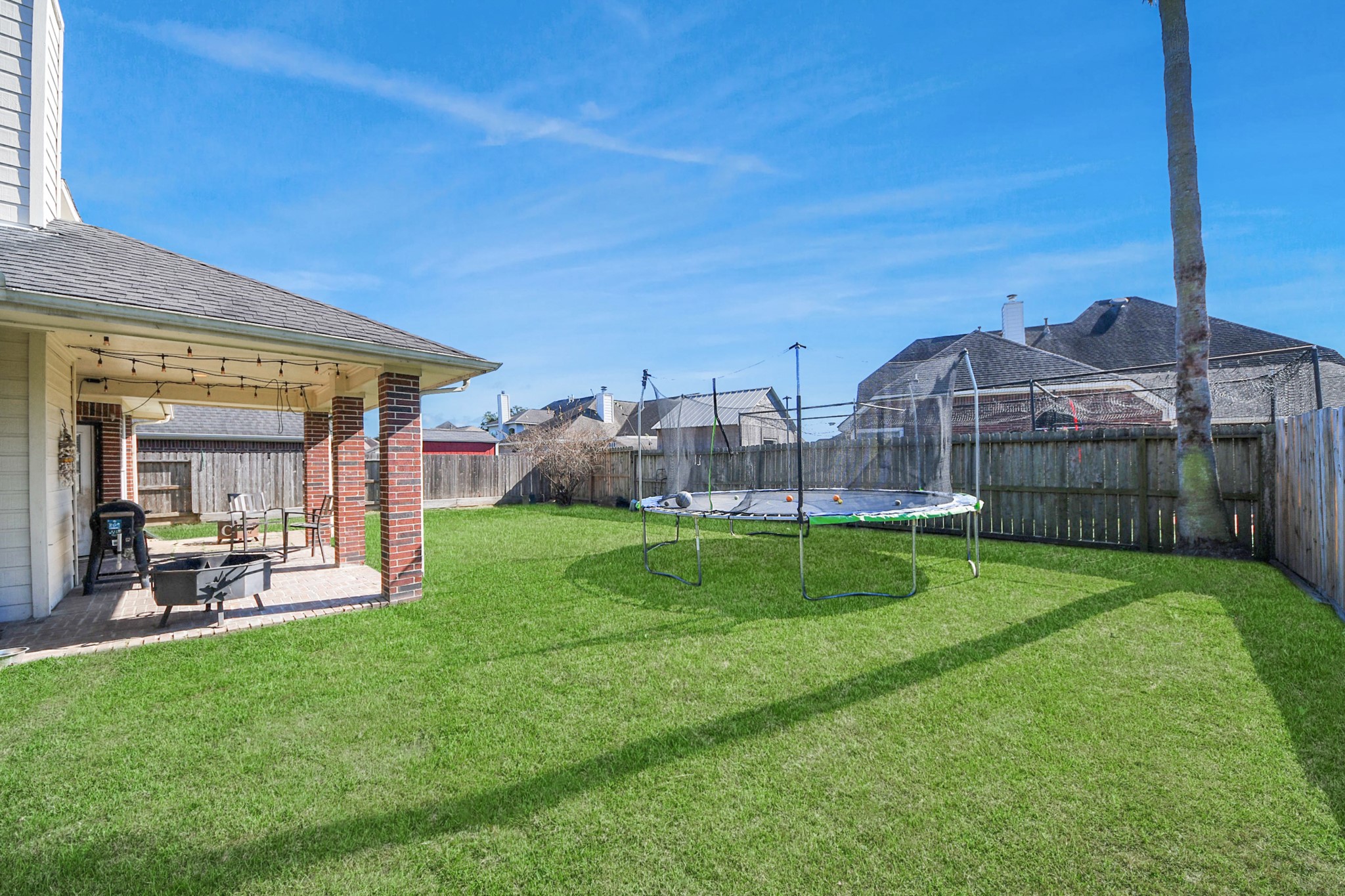 10514 Ravens Way Baytown, TX 77523 - Photo 8 of 50 View from one corner of the yard, capturing the full expanse and versatility of the space.