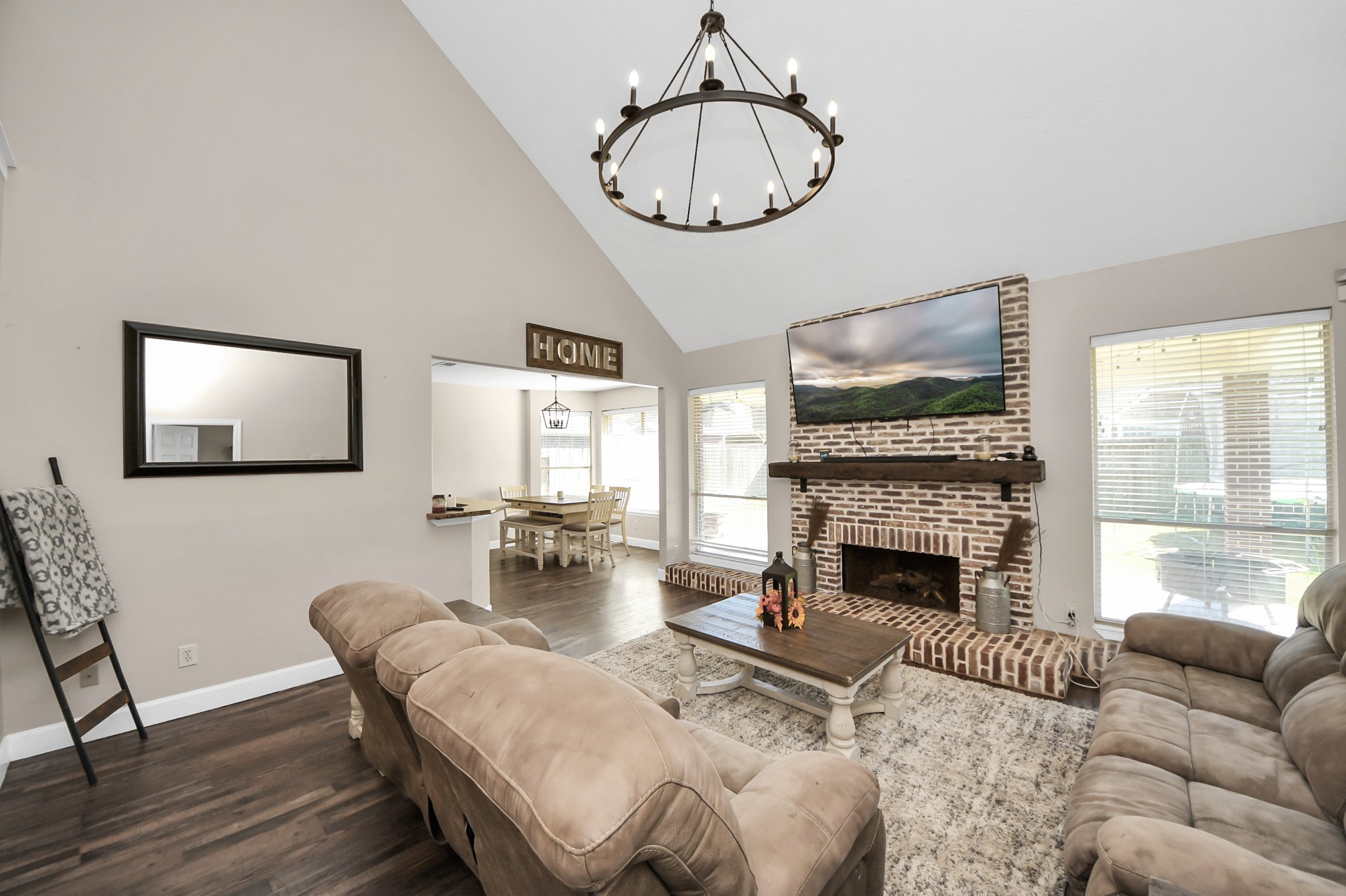 10514 Ravens Way Baytown, TX 77523 - Photo 9 of 50 Bright and open living room with ample natural light, designed for comfortable everyday living and gatherings.