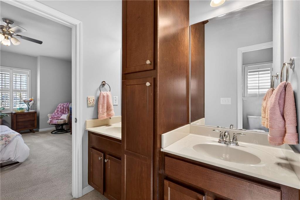 340 Scott Farm Drive Powder Springs, GA 30127 - Photo 35 of 59 a en suite bathroom with a double vanity sink and a mirror