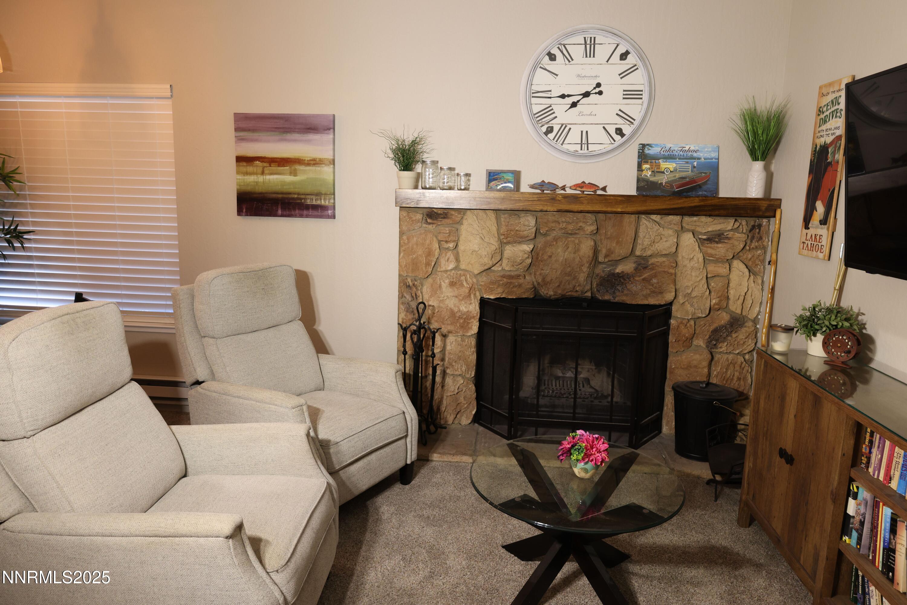 313 Tramway Drive, Unit 8 Stateline, NV 89449 - Photo 4 of 22 a living room with furniture and a fireplace