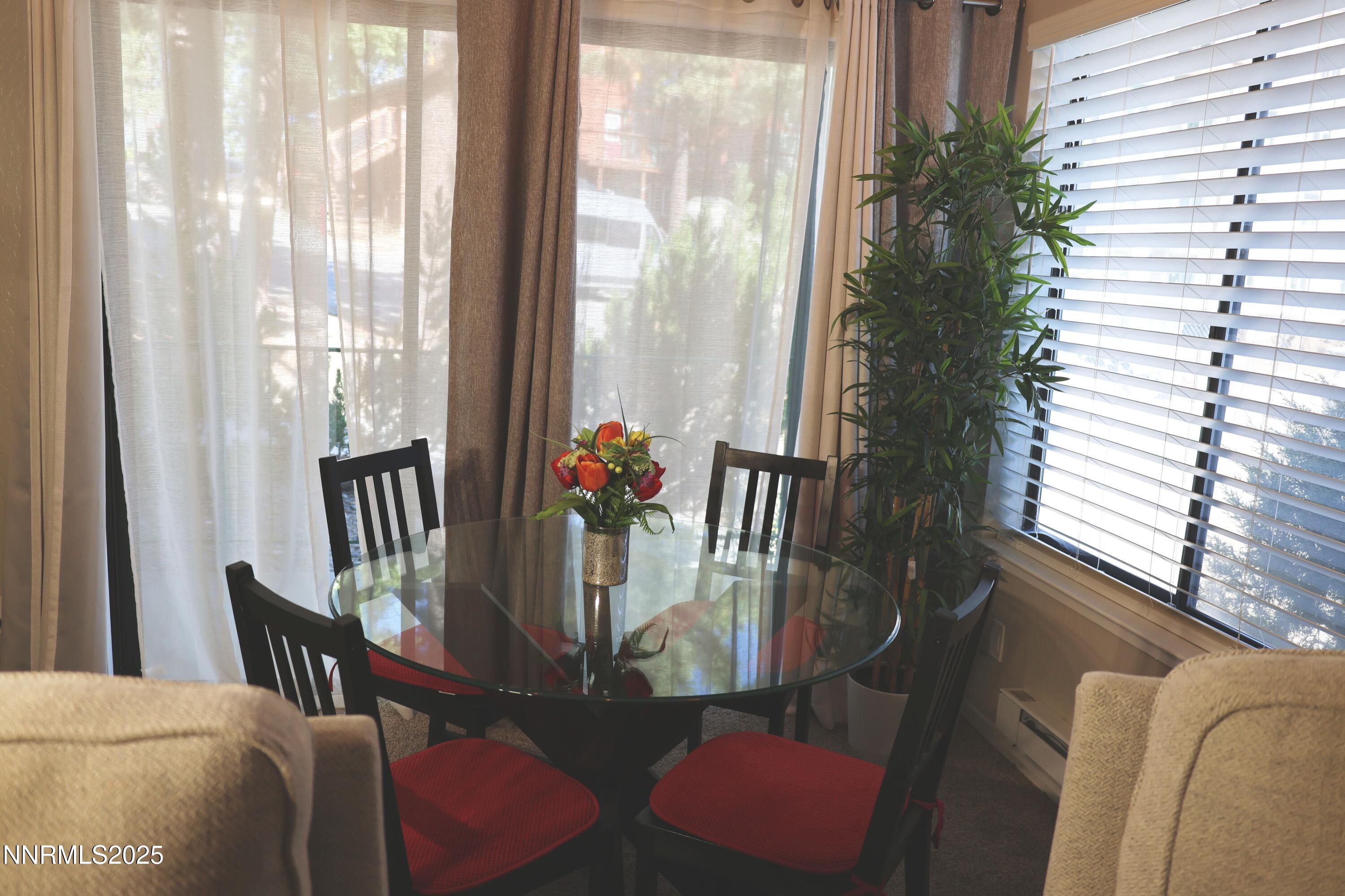 313 Tramway Drive, Unit 8 Stateline, NV 89449 - Photo 5 of 22 a view of a dining room with furniture and window