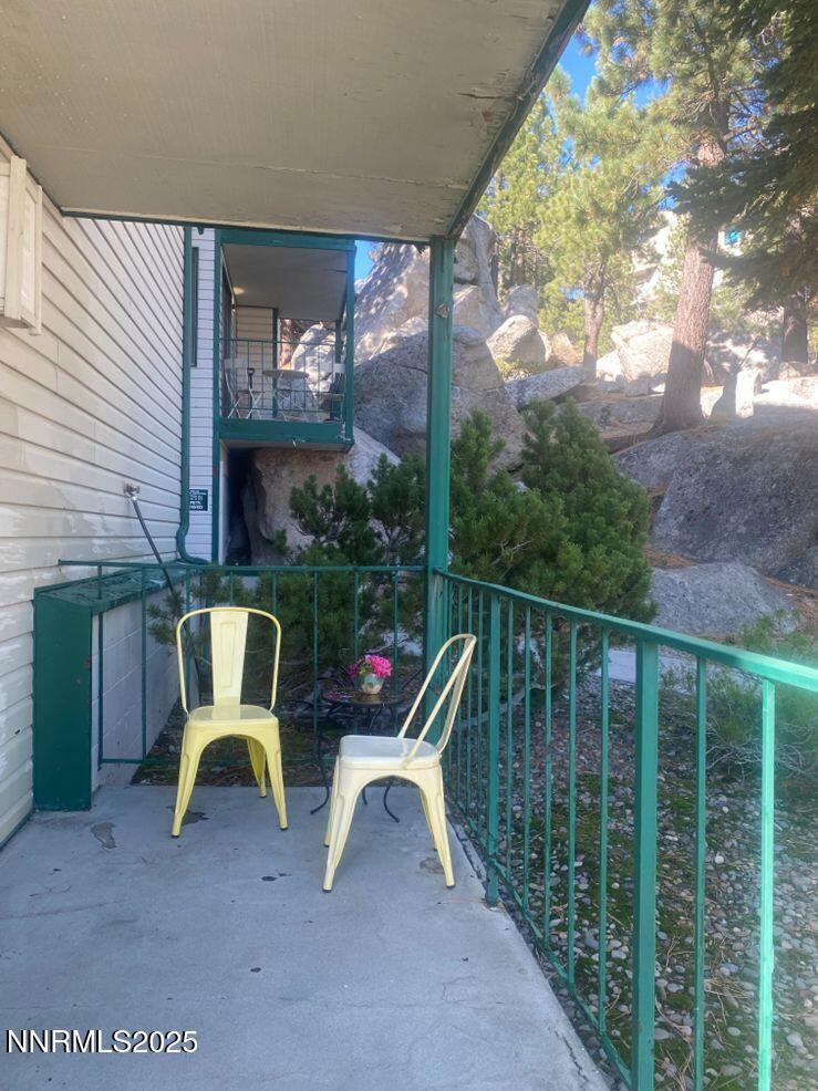 313 Tramway Drive, Unit 8 Stateline, NV 89449 - Photo 10 of 22 a view of a chair and tables in the balcony