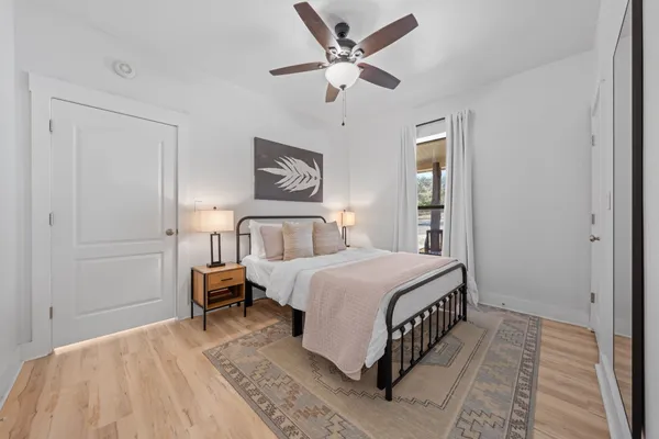 a bedroom with bed and a window