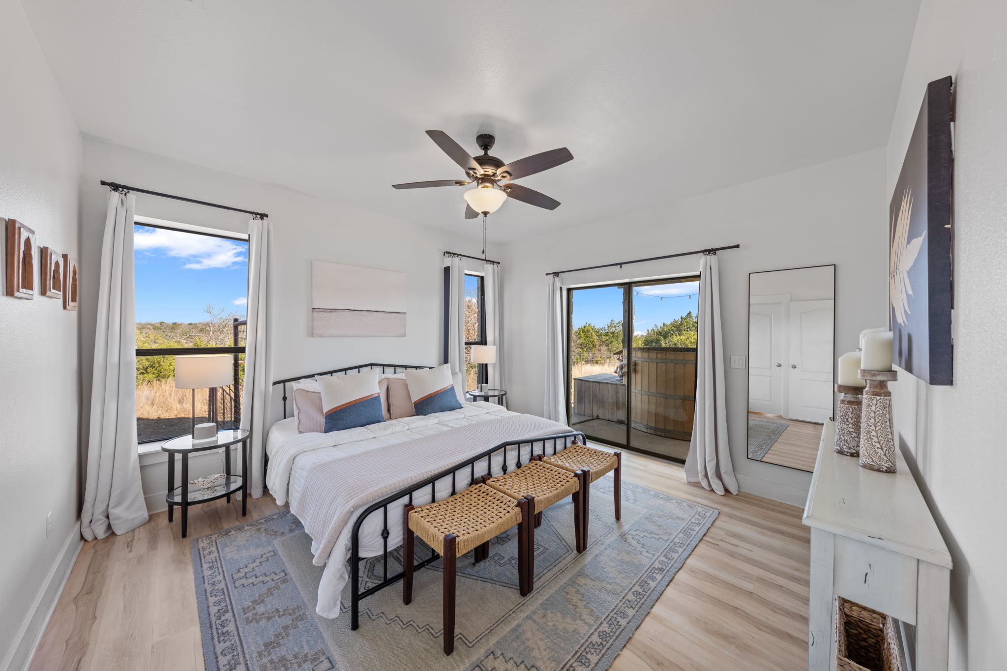 117 Point Road Fredericksburg, TX 78624 - Photo 16 of 40 Bedroom with light wood-style flooring, access to outside, and ceiling fan
