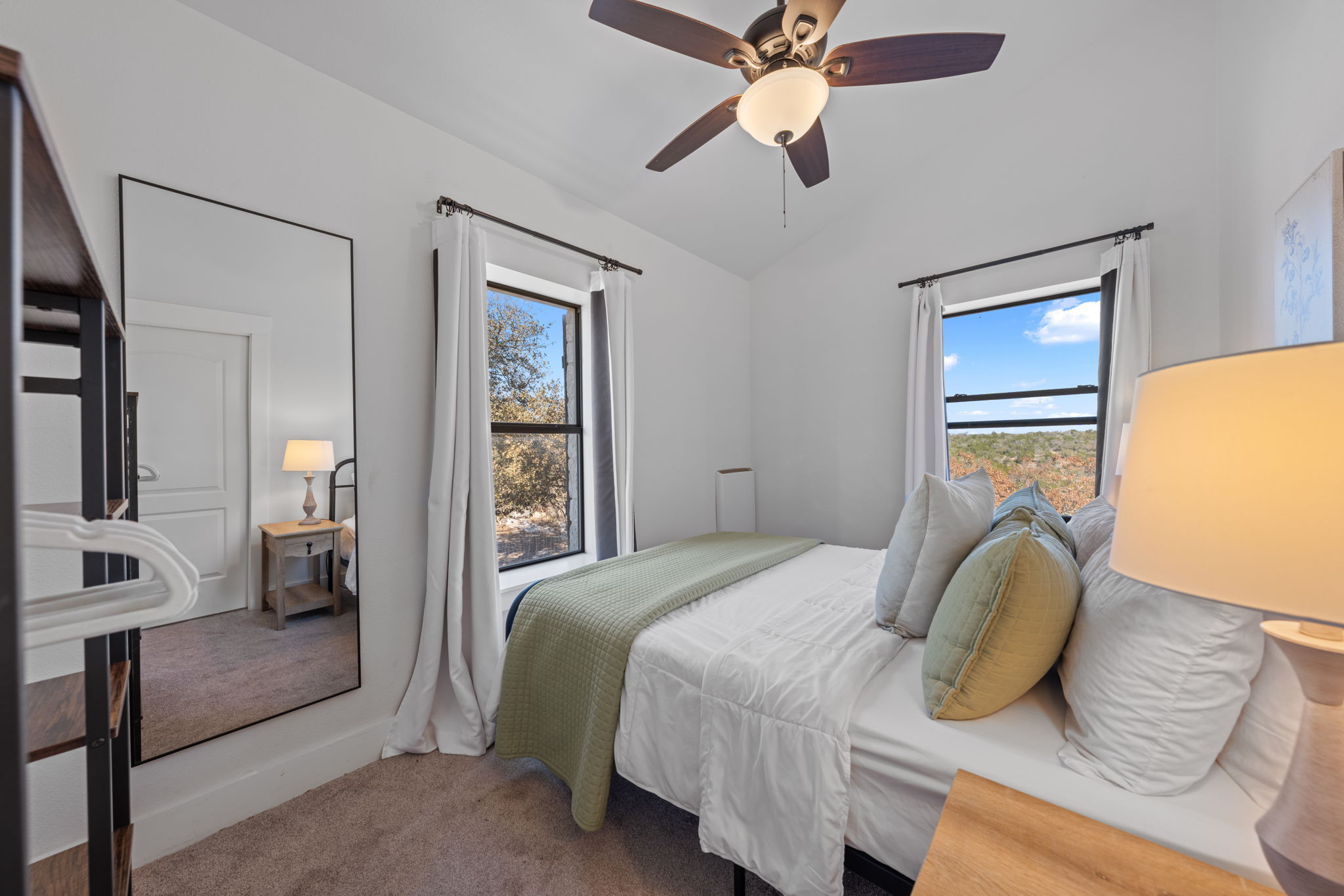 117 Point Road Fredericksburg, TX 78624 - Photo 20 of 40 Bedroom featuring carpet, vaulted ceiling, and ceiling fan