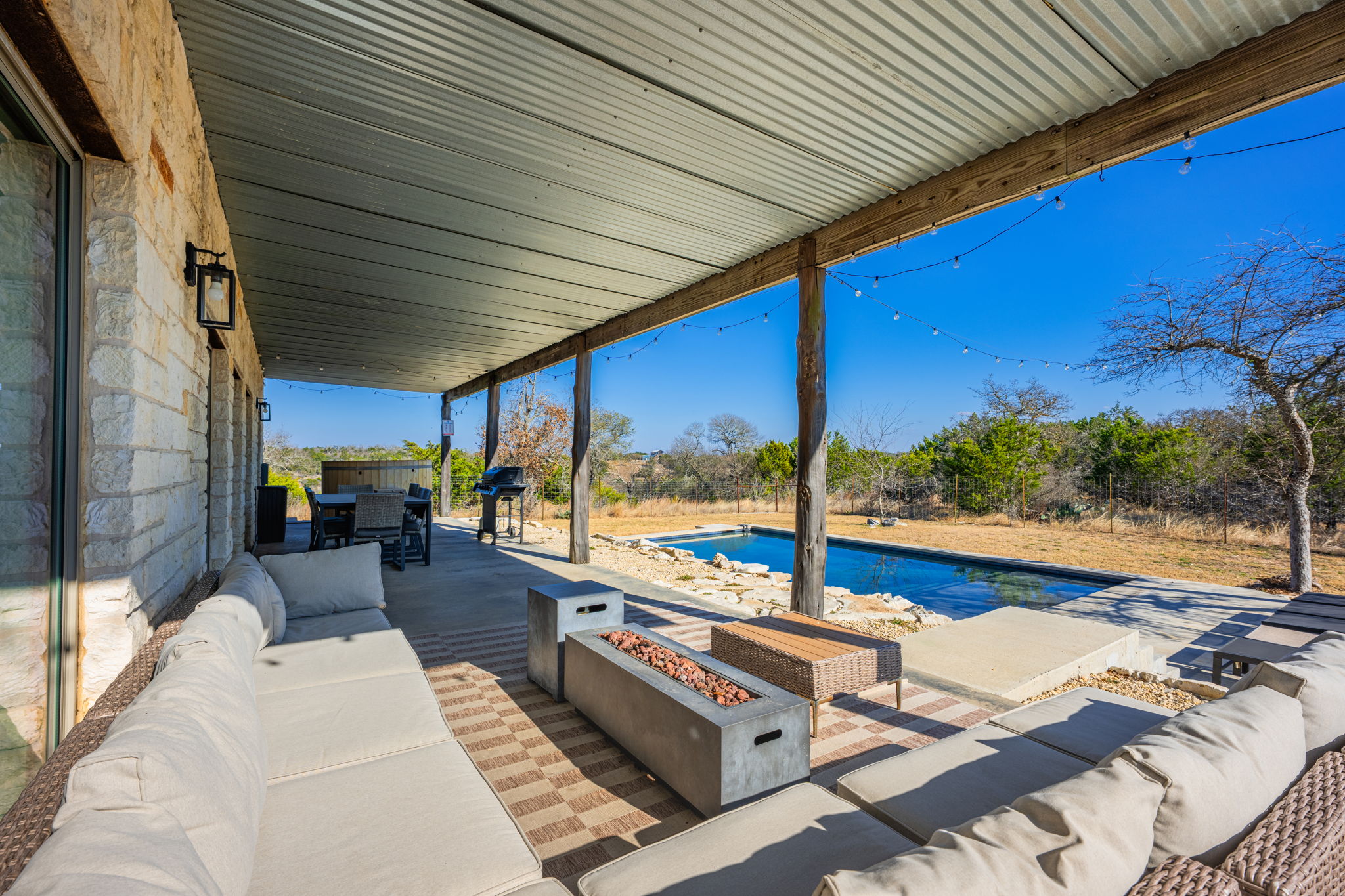 117 Point Road Fredericksburg, TX 78624 - Photo 28 of 40 View of patio / terrace featuring an outdoor fire pit, an outdoor pool, outdoor lounge area, and a grill