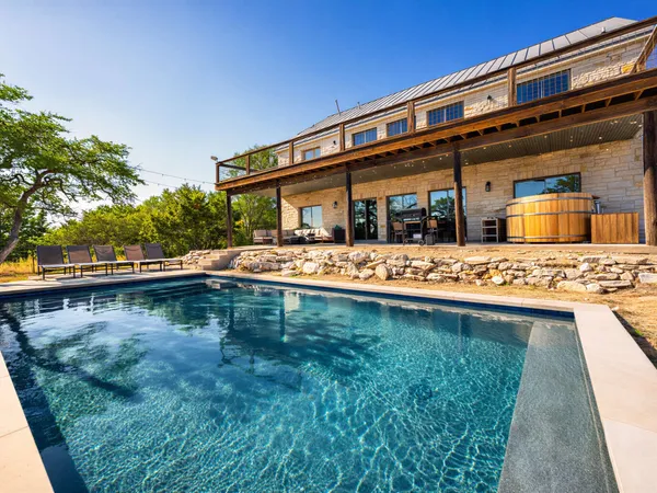 a view of swimming pool with outdoor seating