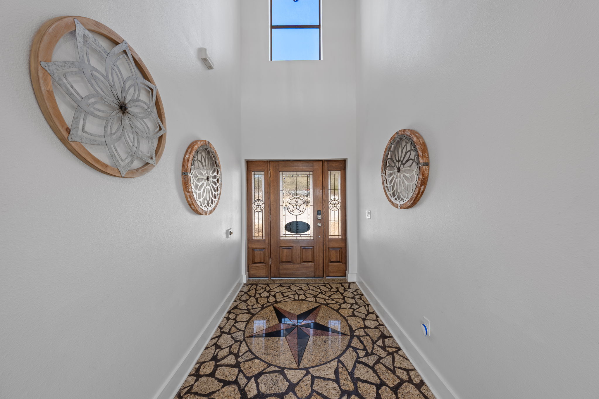 117 Point Road Fredericksburg, TX 78624 - Photo 6 of 40 Entryway with granite floors, a high ceiling, and inlaid floor details