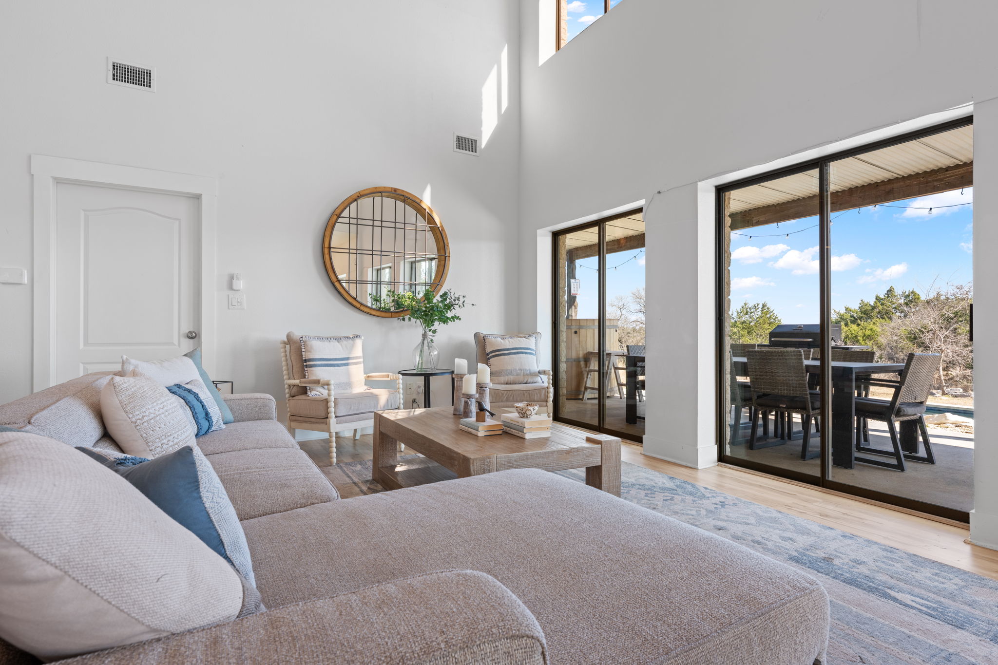 117 Point Road Fredericksburg, TX 78624 - Photo 8 of 40 Living area featuring light wood finished floors and a high ceiling