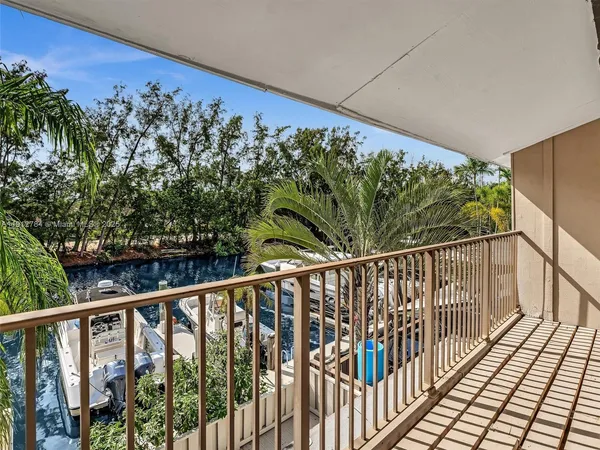 a balcony with view of outdoor space
