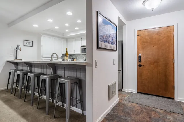 a view of a kitchen from the hallway
