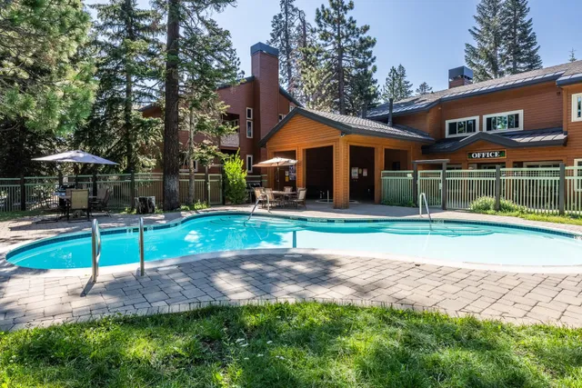 a view of a house with backyard porch and sitting area