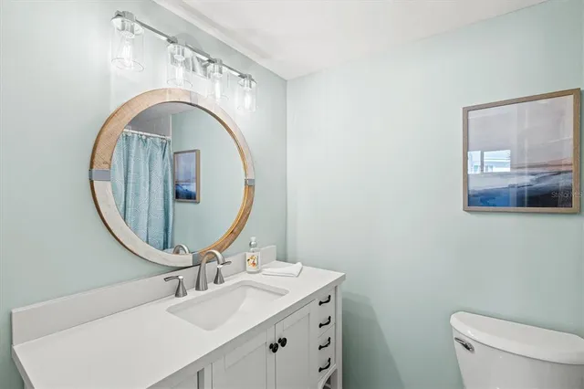 a bathroom with a shower and a sink