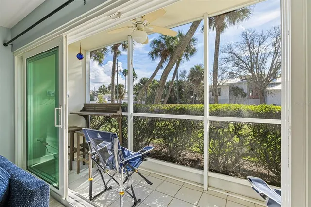 a living room with furniture and a painting on the wall