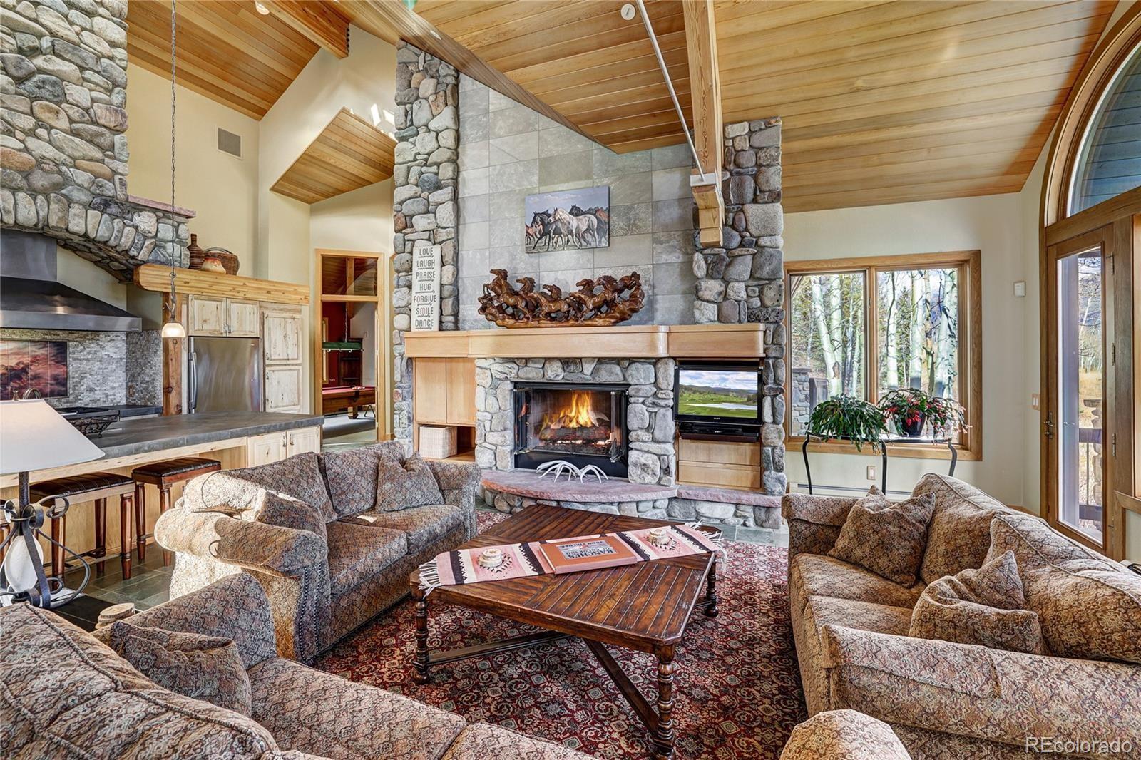 348 Jade Road Silverthorne, CO 80498 - Photo 8 of 48 a living room with furniture and a fireplace