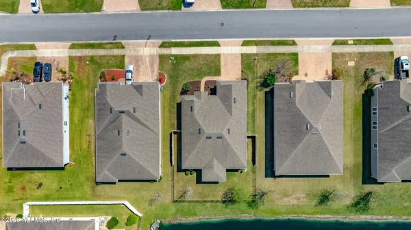 a aerial view of a house with a swimming pool
