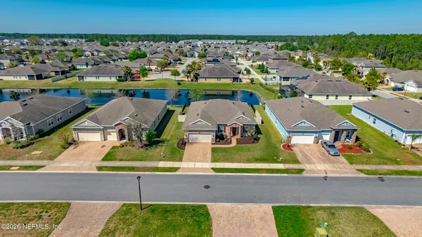 an aerial view of a house with a garden