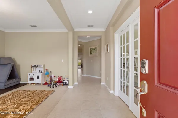 a view of a hallway with a livingroom and a fireplace