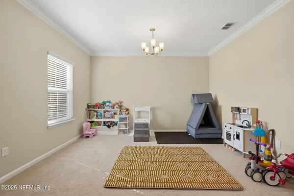 a bedroom with a bed and a book shelf