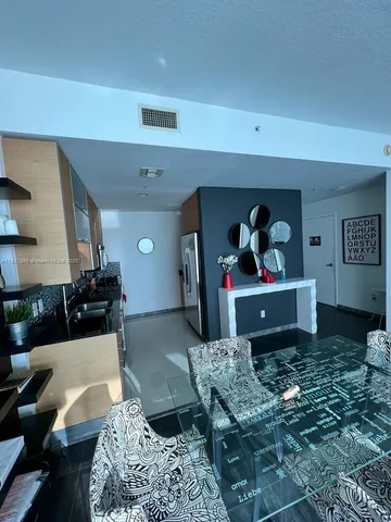 a kitchen with granite countertop a sink and a stove